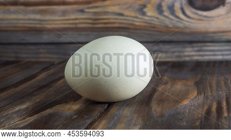 Araucana Egg On Wooden Background. Light Blue Egg From Araucana Chicken. Easter Festival Concepts. E