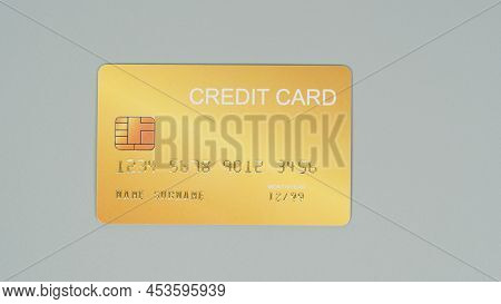 Gold Credit Card Isolated On Grey Background.nopeople.