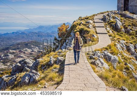 Woman Traveller In Mountain Landscape At National Park Lovcen, Montenegro. Travel To Montenegro Conc