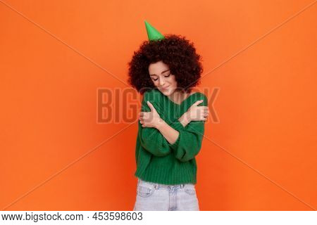 Kind Birthday Woman With Afro Hairstyle Wearing Green Casual Style Sweater And Party Cone, Celebrati