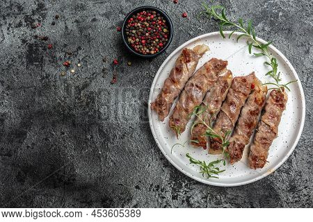 Chevapchichi Or Kofta Kebab, Bacon Wrapped Minced Meat With Spinach, Avocado And Cherry Tomato, Heal