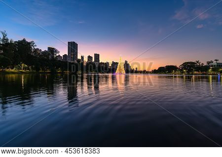Igapo Lake At Sunset During Christmas, Londrina - Pr, Brazil. Beautiful City Lake With Christmas Tre