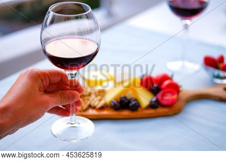 Two Glasses Of Wine And Cheese Plate. Aperetif.