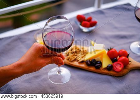 Two Glasses Of Wine And Cheese Plate. Aperetif.