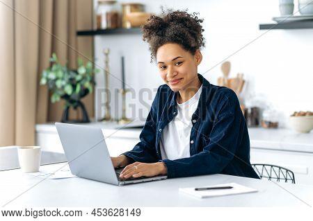 Portrait Of Lovely Confident African American Female Student, Freelancer, Company Worker, Working Or
