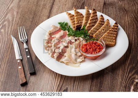 Raw Chopped Pork Lard With Meat, A Head Of Garlic And Rye Bread On A Wooden Background For Copy Spac
