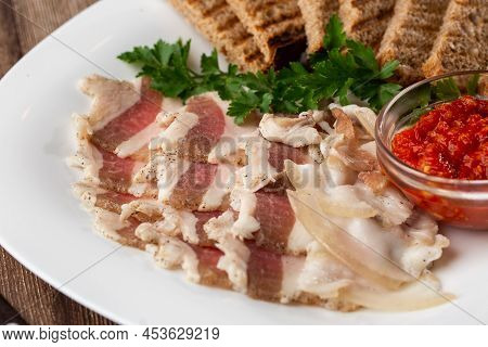 Raw Chopped Pork Lard With Meat, A Head Of Garlic And Rye Bread On A Wooden Background For Copy Spac