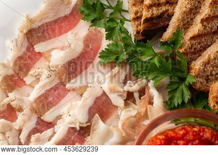 Raw Chopped Pork Lard With Meat, A Head Of Garlic And Rye Bread On A Wooden Background For Copy Spac