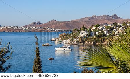 Blue Sea, Islands And Boats On The Aegean Coast. Summer Vacation And Coastal Nature Concept