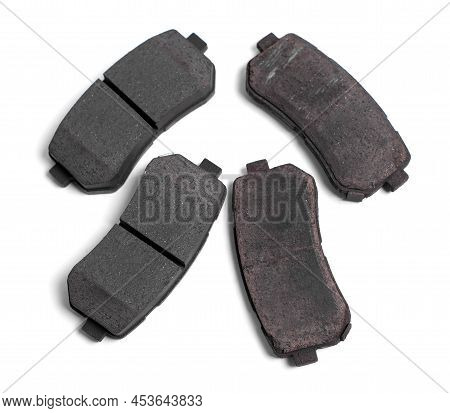 Set Of Brake Pad. Comparison Of New And Old Pads. Spare Parts For Car Isolated On White Background