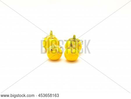 Four Over Ripen Yellow Small Round Eggplant For Heirloom Seed Saving Isolated On White Background