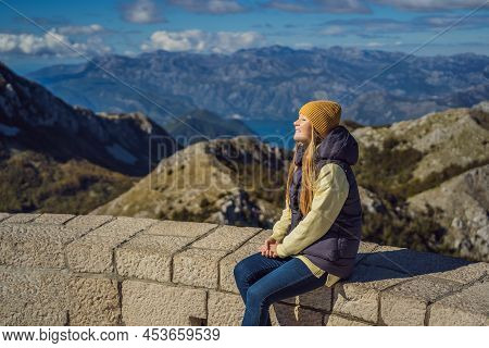 Woman Traveller In Mountain Landscape At National Park Lovcen, Montenegro. Travel To Montenegro Conc