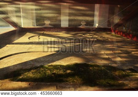 Ancient Ruin Antique Old Footprint Of Buddha In Wat Si Khom Kham Temple For Thai People And Foreign 