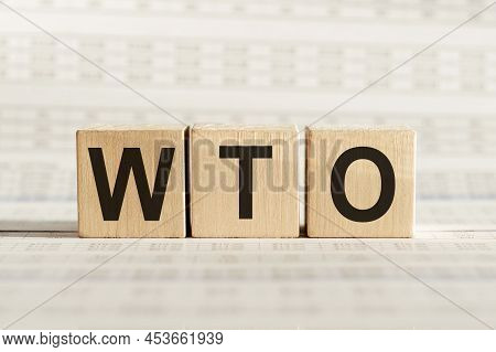 Wto - World Trade Organization, On Wooden Cubes On A Light Background.