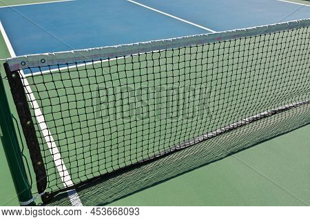 Pickleball Is A Paddleball Racket Sport Combining Elements Of Badminton, Table Tennis, And Tennis.