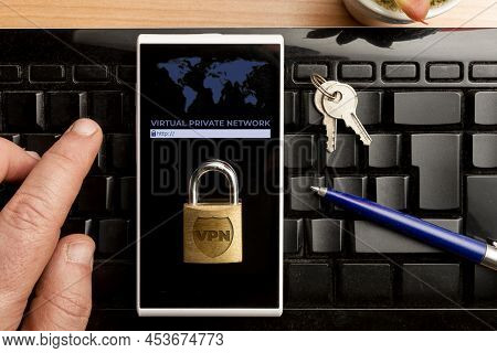 Vpn (virtual Private Network) Concept, Man Using A Vpn Software On A Smartphone