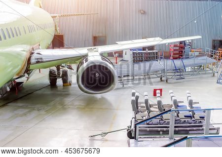 Industrial Theme, View In The Hangar Of The Removed Passenger Seats On The Trolley From The Aircraft