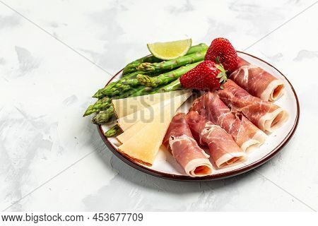 Asparagus. Bunch Of Fresh Asparagus, Jamon, Ham, Prosciutto Pickled Green Asparagus. Close Up. Keto 