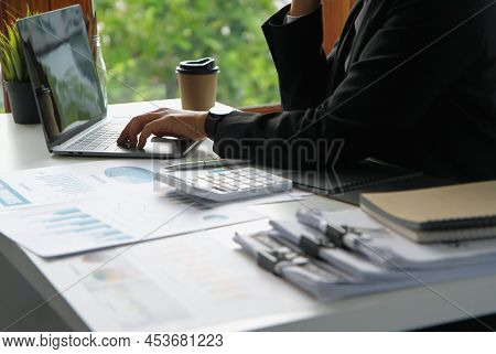 Financial Advisor Using Computers Laptop, Data Acquisition And Calculations, Numbers, Datasheets, Gr