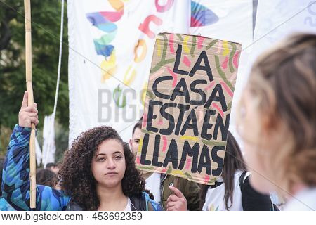 Buenos Aires, Argentina; April 22, 2022: Earth Day Demonstration, Young Woman Activist Holding A Sig