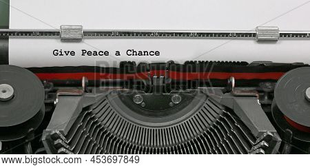 Ancient Typewriter With The Text Give Peace A Chance Which Is A Message Of Hope And Against Violence