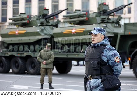 Moscow, Russia - April 2022: Russian Soldiers Standing In Front Of Combat Multifunctional Robotic Co