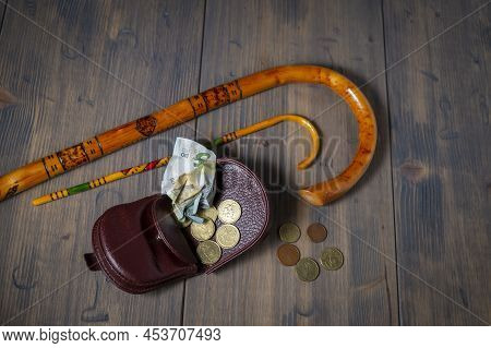 Conceptual Covid-19 Flat Lay Still Life With Money Spilling From An Open Purse Onto A Wooden Table W
