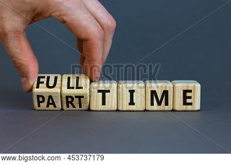Full Or Part Time Symbol. Businessman Turns Wooden Cubes And Changes Words 'full-time' To 'part-time