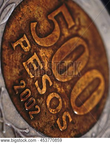 Translation: 500 Pesos. Coin Of 500 Chilean Pesos Close-up. Peso Of Chile. News About Economy Or Ban