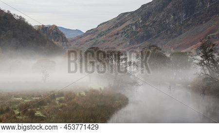 Stunning Autumn Landscape Sunrise Image Looking Towards Borrowdale Valley From Derwentwater In Lake 