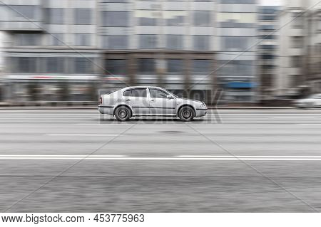 Skoda Octavia Automobile On The Road In Motion. Fast Speed Drive On City Road. Side View Of Moving O