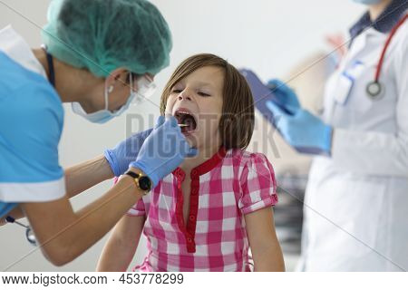 Close-up Of Female Nurse, Takes Cotton Bud To Analyze Saliva, Nasal Swab, Mucous Membrane For Dna Te