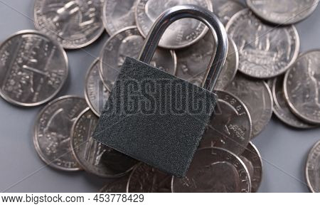 Close-up Of Padlock On Coins, Financial Security And Protection Finance. Keep Savings In Secure Plac