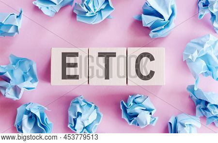 On A Bright Pale Lilac And Blue Background, Light Wooden Blocks And Cubes With The Text Etc.