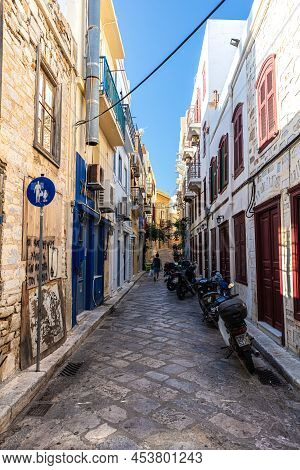 Ermoupoli, Greece - July 6, 2021: Typical Mediterranean Narrow Street Alley On The Greek Island Of S