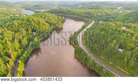 Aerial View Of The Gatineau River Near The Village Wakefield, Canada. Clouds Reflecting In The River