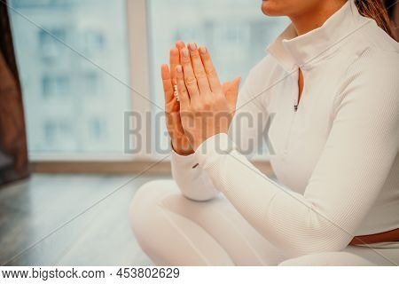 Athletic Slim Caucasian Woman Doing Thigh Self-massage With A Massage Ball Indoors. Self-isolating M