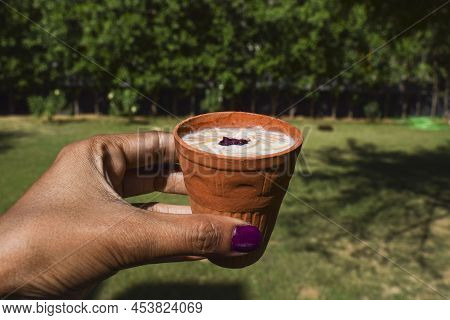 Female Holding Kulhad Glass Of Delicious Dessert From India And Pakistan Served During Festivals Lik