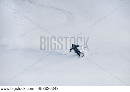 View On Snowboarder Riding Down The Untouched Powder Snow.