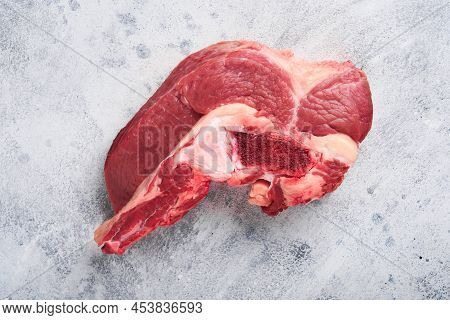 Raw Beef Meat. Rough Piece Of Meat On Bone For Roast Or Soup With Salt, Pepper, Thyme And Rosemary O