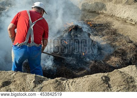 Amarante, Portugal - April 30: Final Stage Of Uncovering The Bonfire With The Pieces Of Clay Piled U