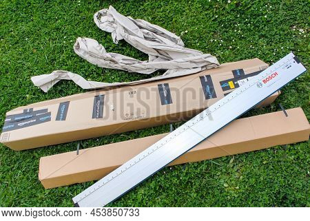 Paris, France - Apr 29, 2022: Unboxing Npacking Large Amzon Parcel Cardboard With The Bosch Professi