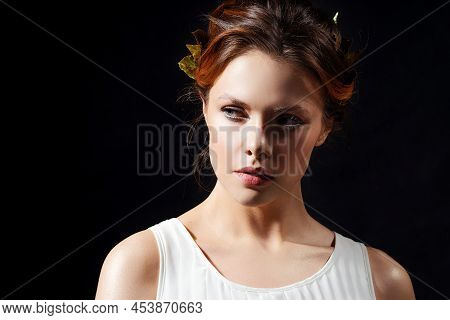 A Beautiful Ancient Goddess From The Era Of The Heroes Of Hellas. A Young Woman In A White Tunic And