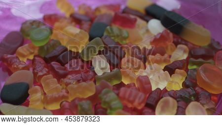 Mixed Sweeties, Colorful Gummy Candies On A Pink Glass Plate. Gummy Sweeties, Jelly Sweet, Candy Des