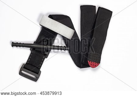 Hemostatic Tourniquet On A White Background Top View. A Tourniquet To Stop Bleeding. Bandaging The W