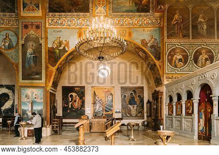 Shio-mgvime, Mtskheta, Georgia - March 18, 2022: Fresco, Frescoes. People Praying In Shio-mgvime Mon