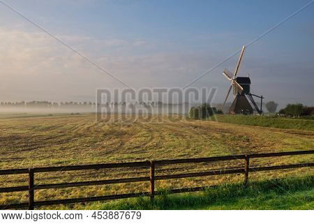Gate In Front Of A Windmill Near Bleskensgraaf