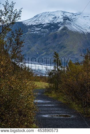 Iceland Autumn Tundra Landscape Near Haoldukvisl Glacier, Iceland. Glacier Tongue Slides From The Va