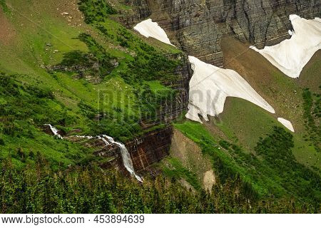 Morning Eagle Falls Drops Off Clff Edge Below Piegan Pass In Glacier National Park