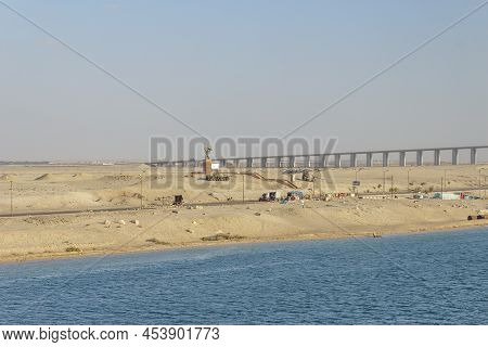 Suez Canal, Egypt - Mar 27 2013: War Memorial North Side Of Al Salam Bridge, Seen Onboard From A Ves